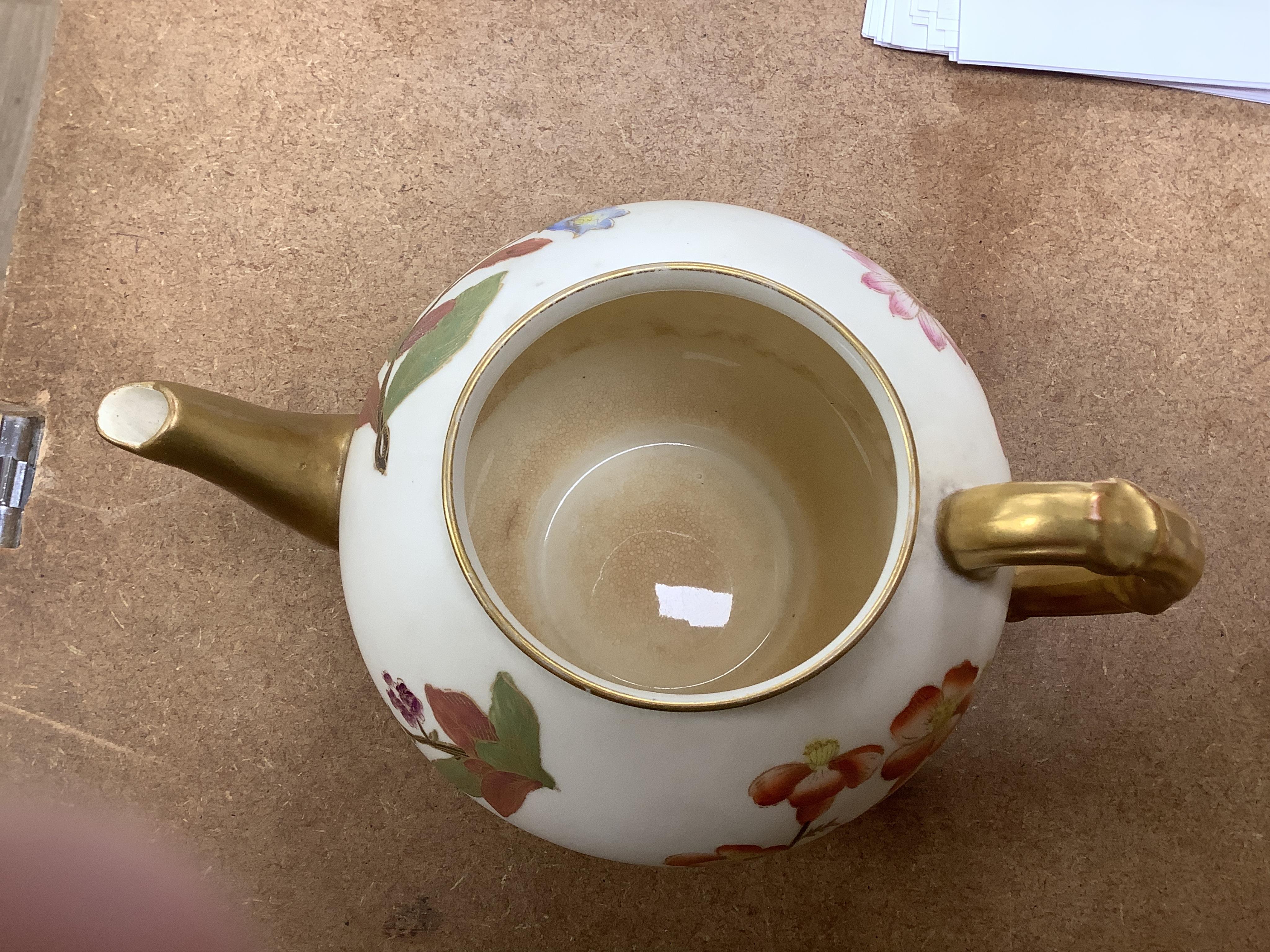 Four 19th century Worcester blush ivory teapots, with floral decoration and decorative handles, largest 20cm wide